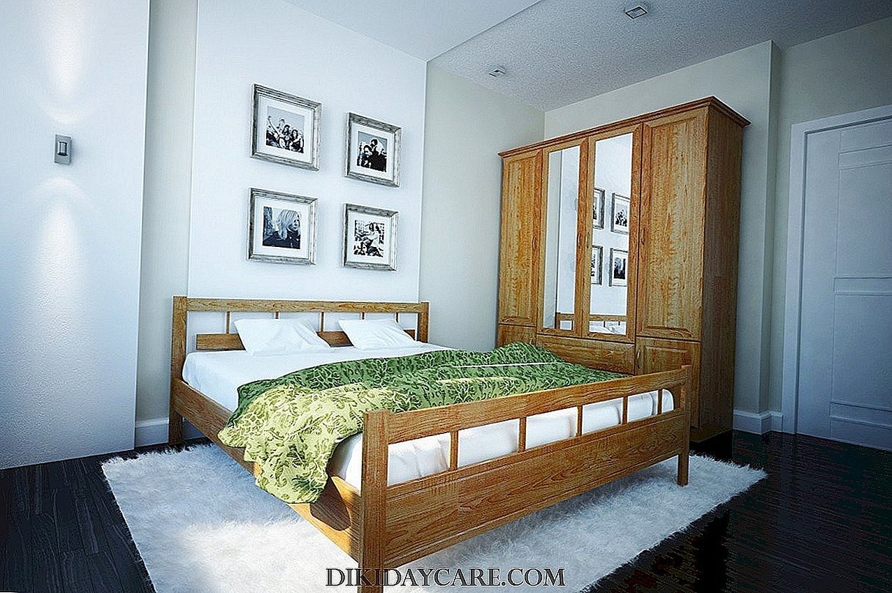Деревянная кровать в интерьере спальни